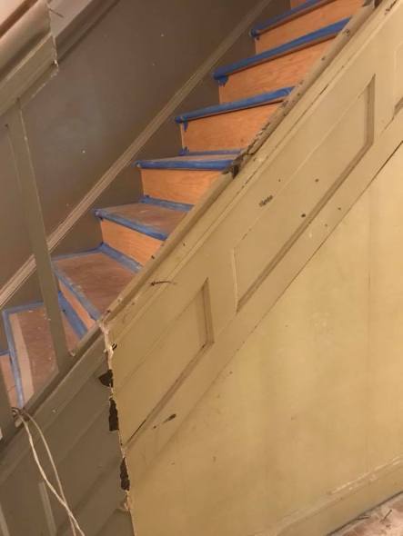 Pretty woodwork hidden behind drywall