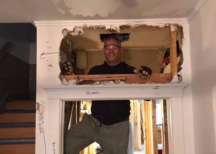 Demo Dan taking down the door